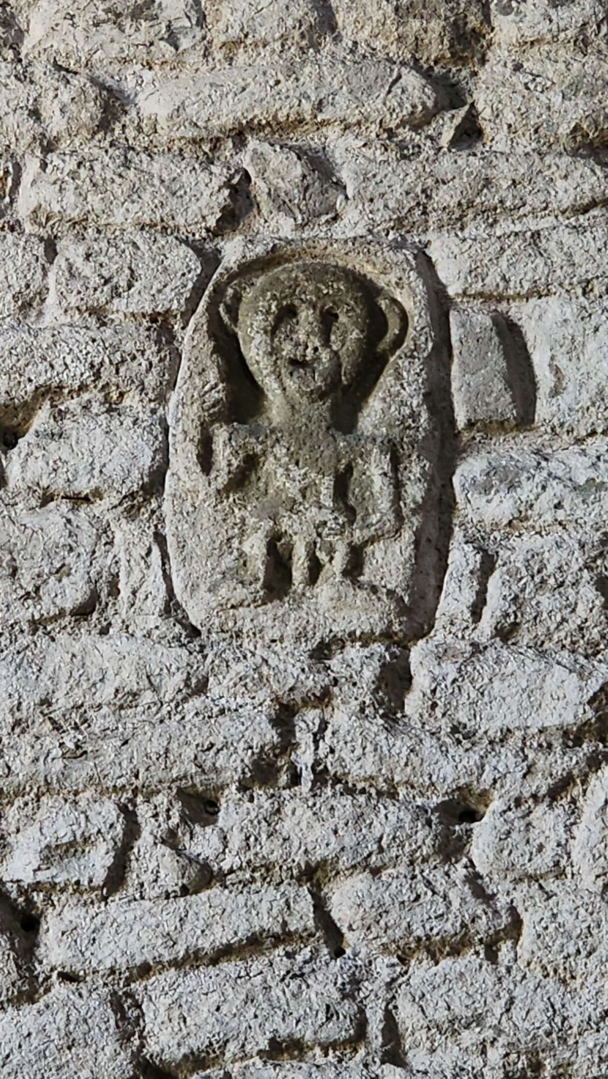 The apotropaic figure on the left aisle