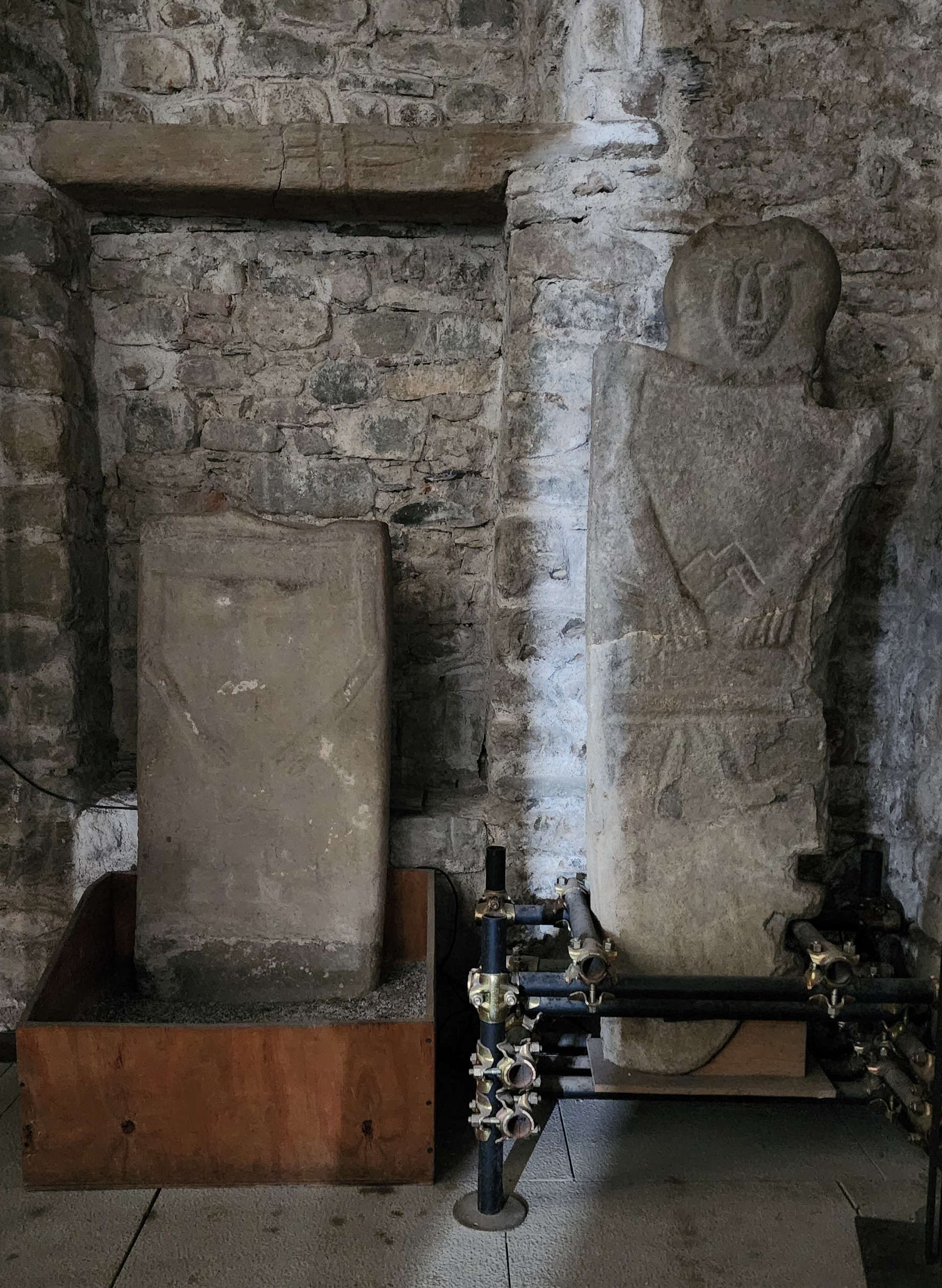 The stele statues inside the parish church of Sorano