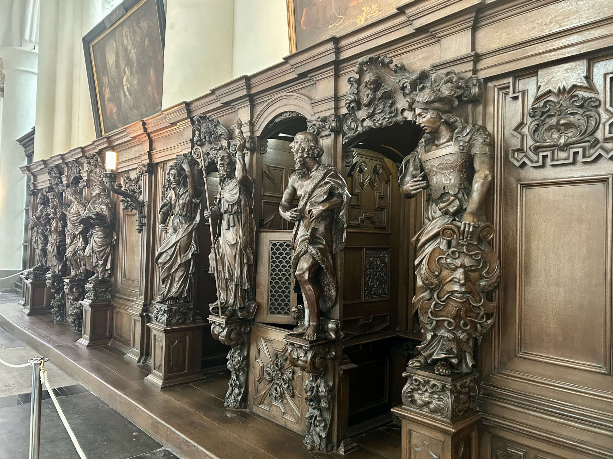 Oak-carved confessionals by Jacob Berger and Ludo Hagheman