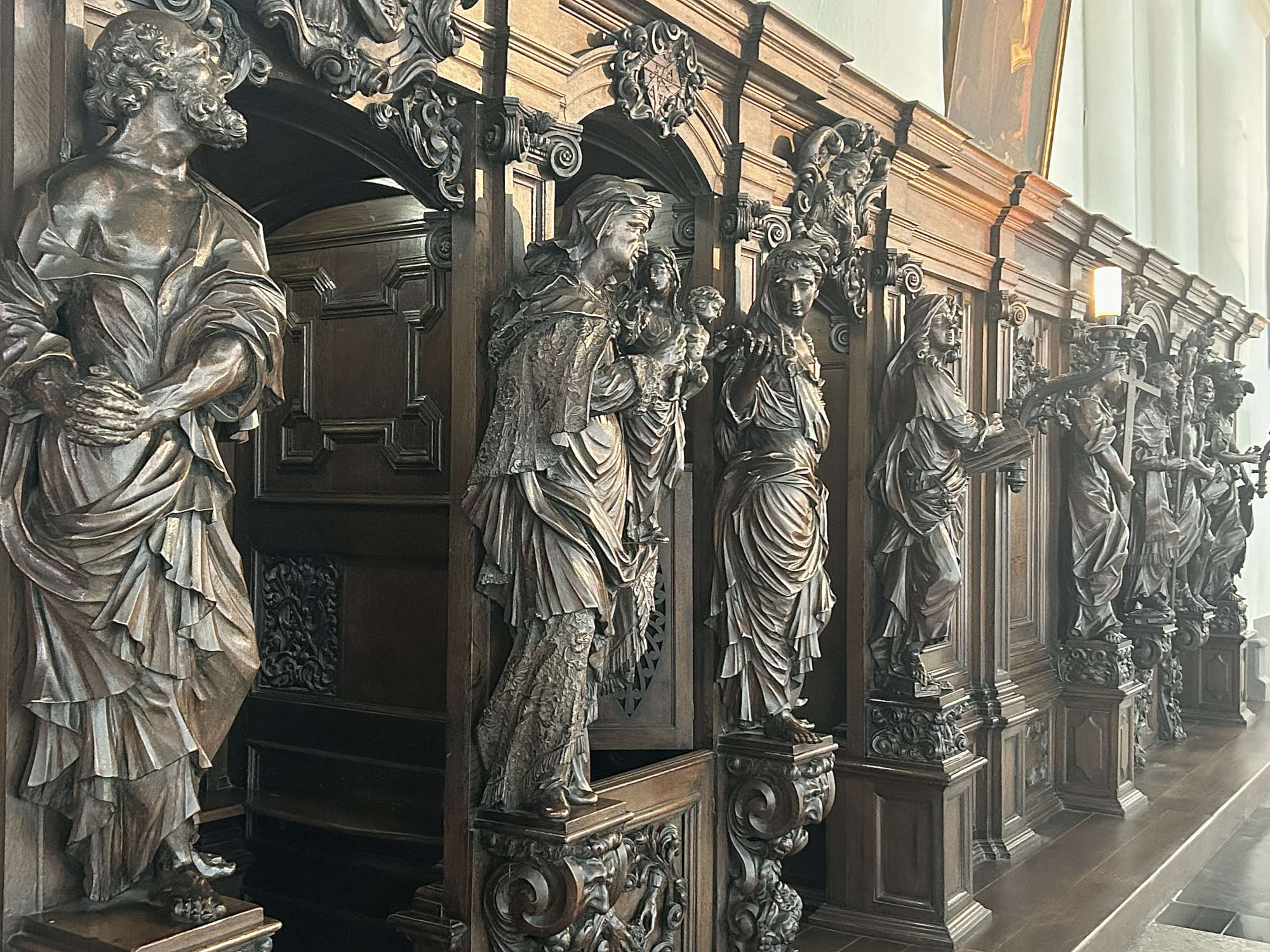 Oak-carved confessionals by Jacob Berger and Ludo Hagheman